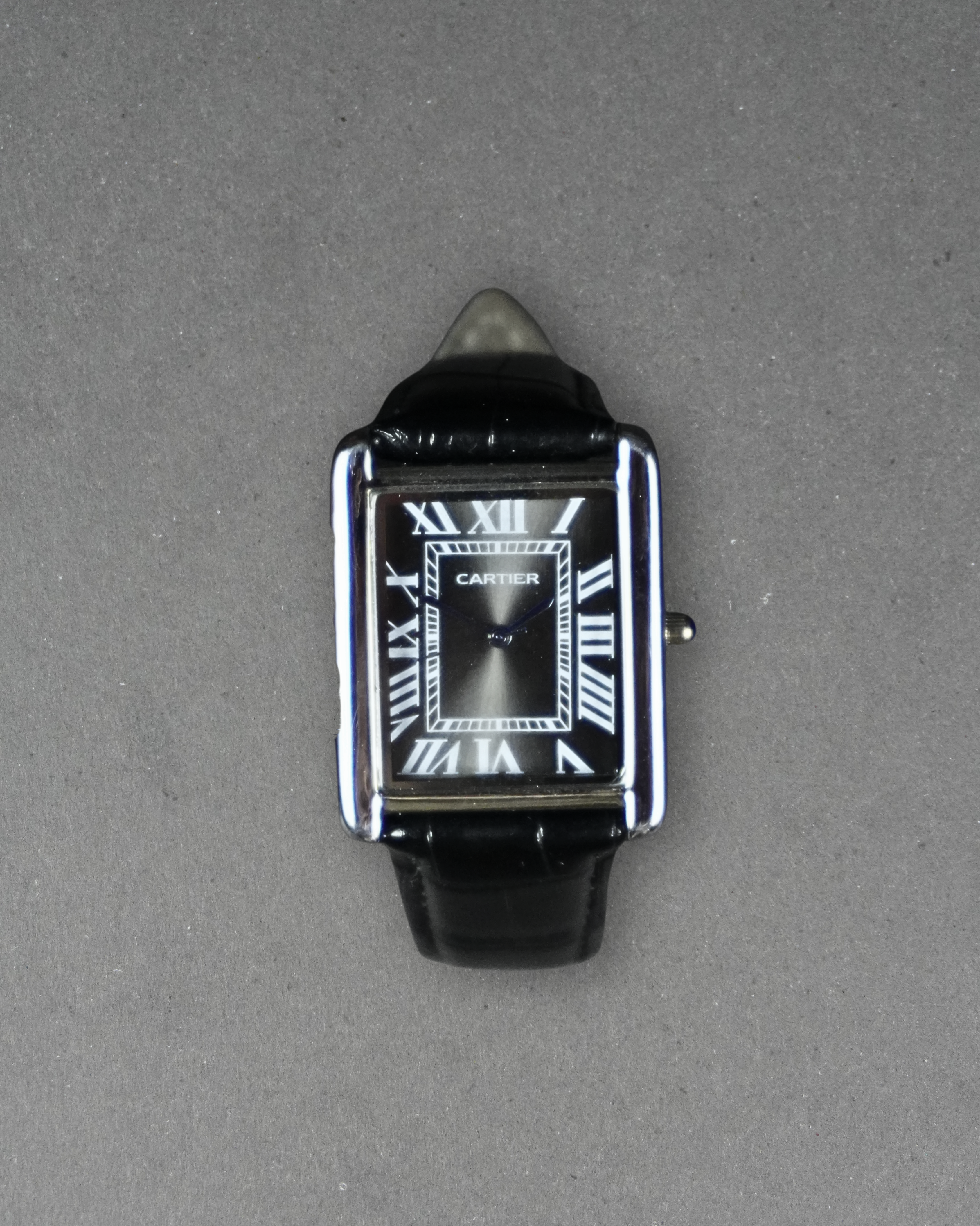 Cartier Tank rectangular case with a Roman numeral dial
