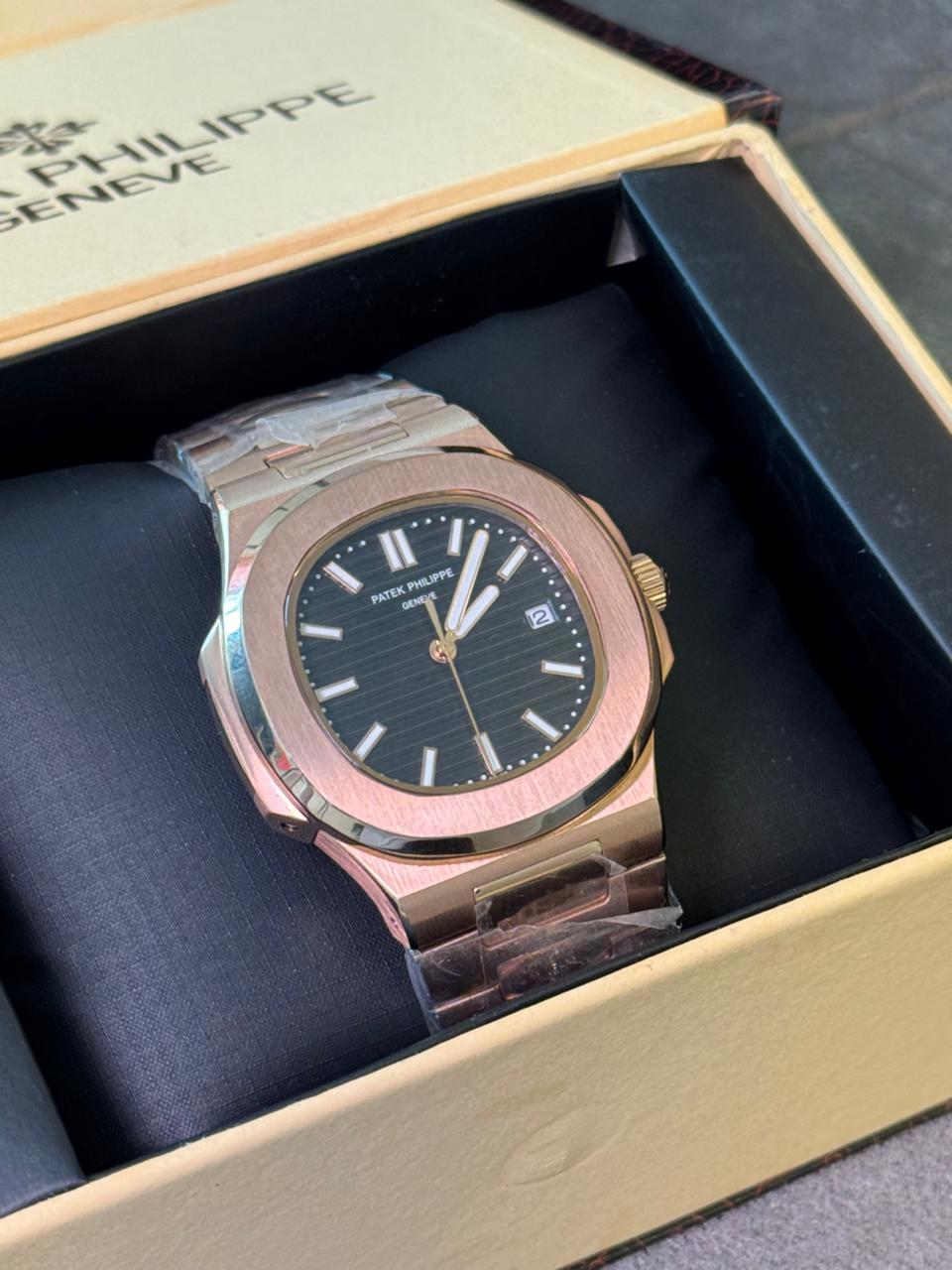 Patek Philippe with a brown gradient dial rose gold chain